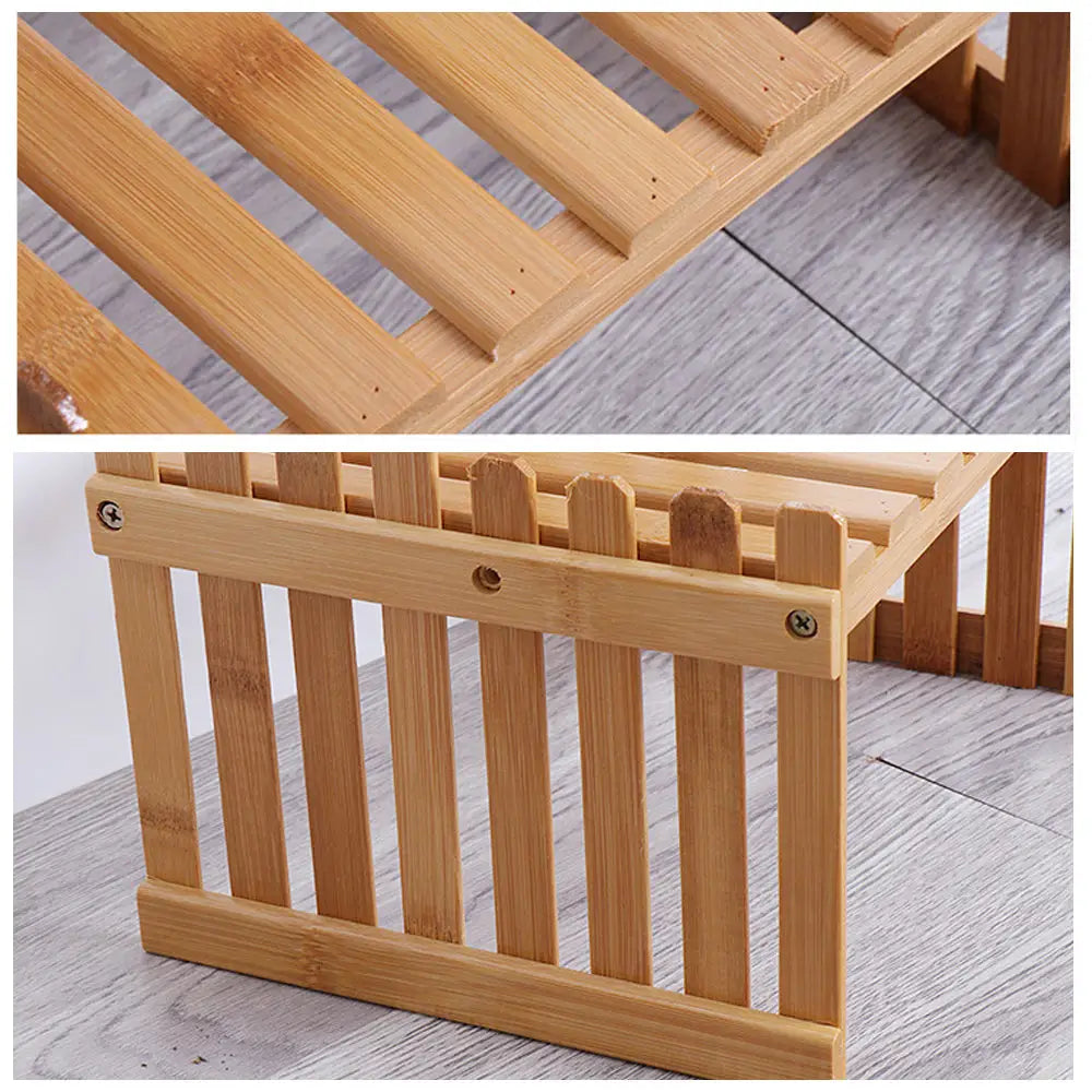 Wooden bed frame with slatts displayed on 2 tier bamboo plant stand