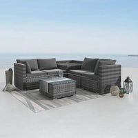 Outdoor living furniture set featuring a grey wicker sofa and coffee table on patio - 720mm x 720mm dimensions