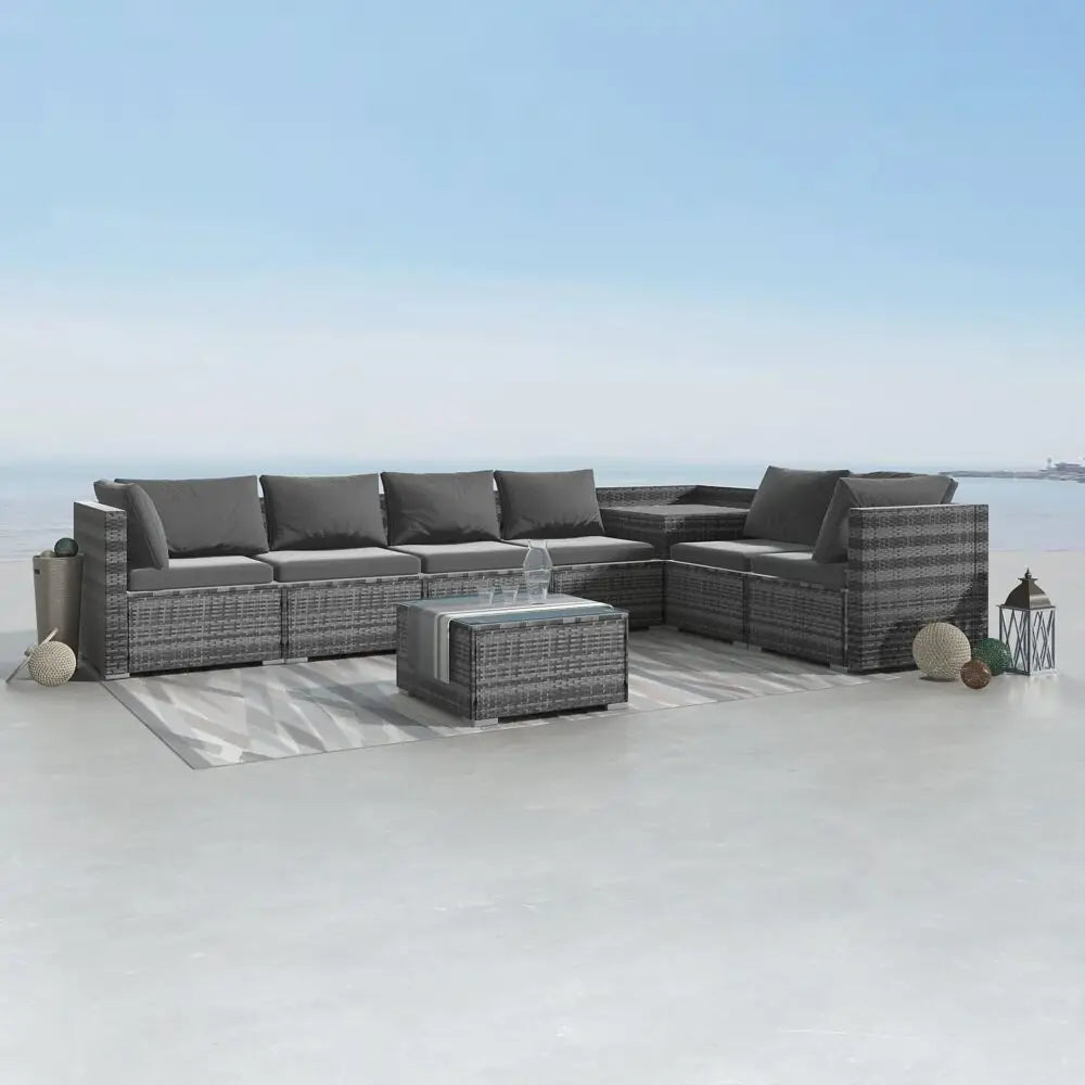 ’close up of modular lounge set with couch and coffee table on white floor’