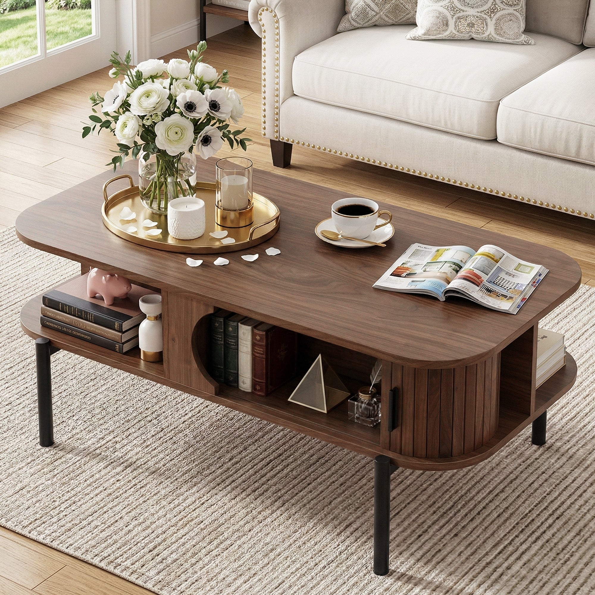 Wooden coffee table with books, a vase of flowers, and a newspaper in a living room setting.