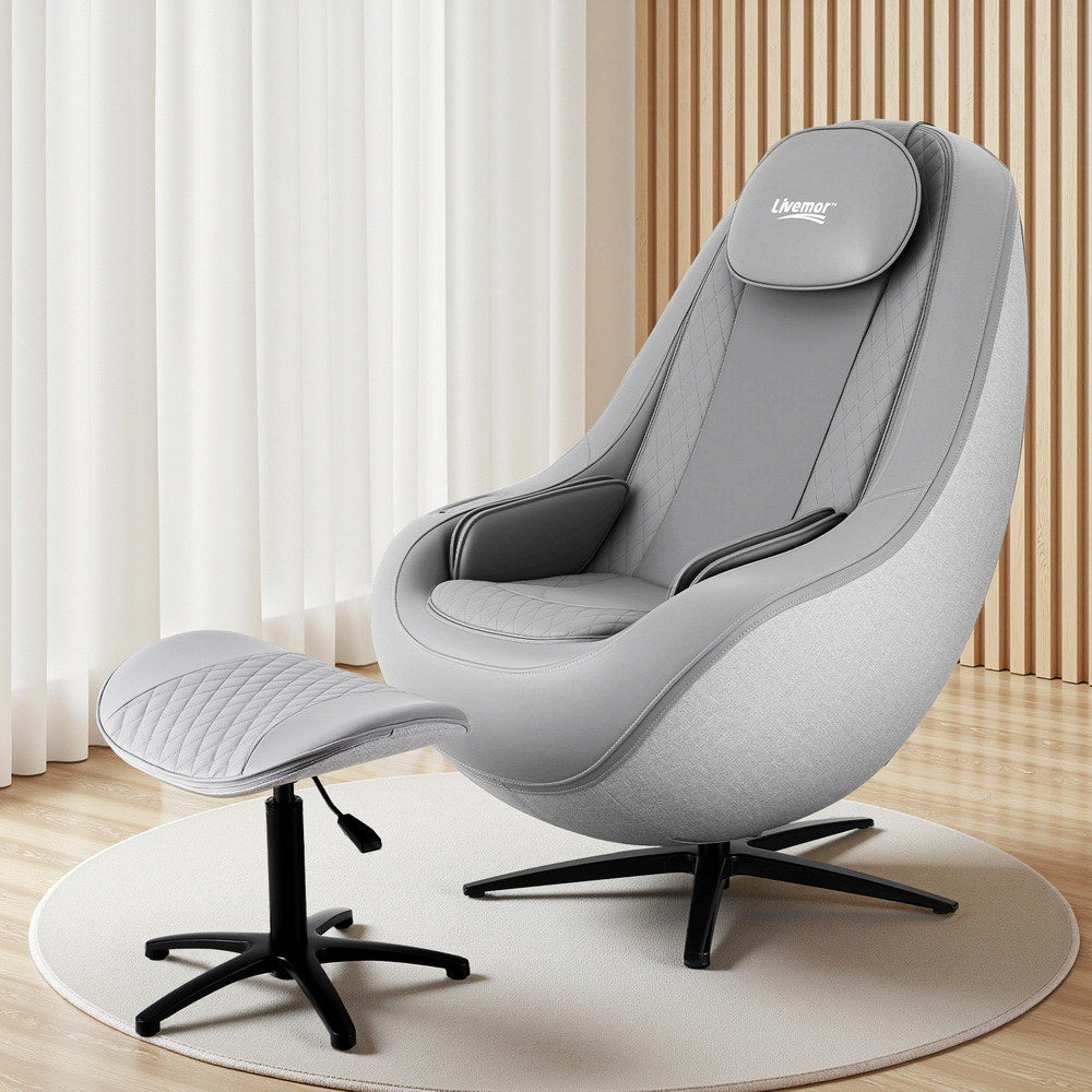 Gray massage chair with ottoman on a wooden floor