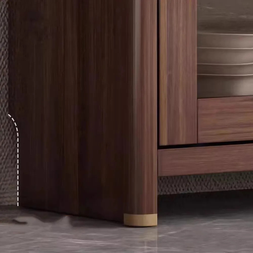 Close-up of a wooden cabinet with a focus on the base and corner.
