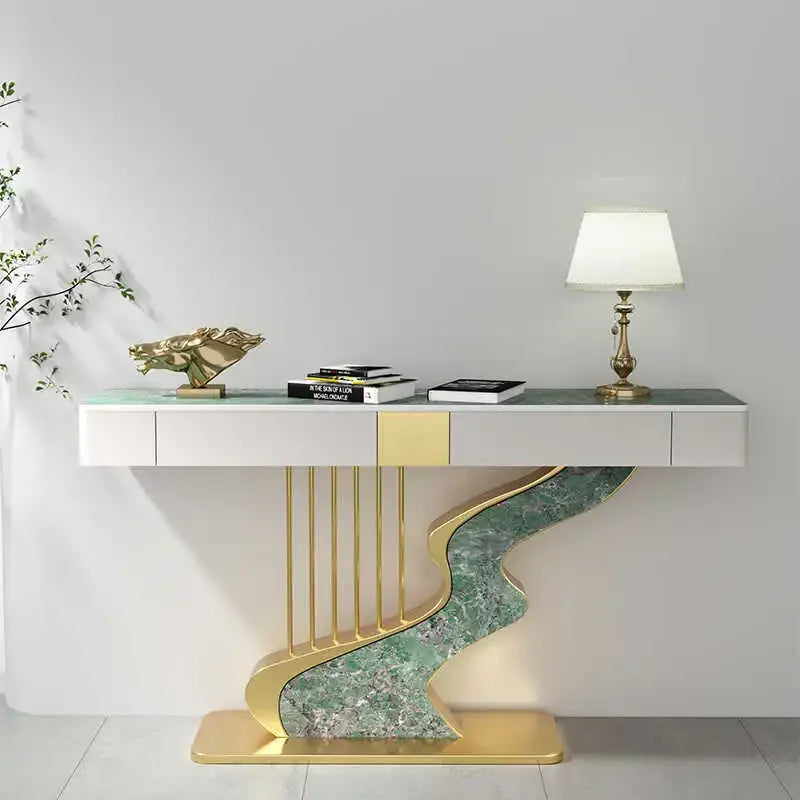 Modern console table with gold and green design against a white wall