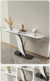 Modern console table with decorative items against a striped wall.