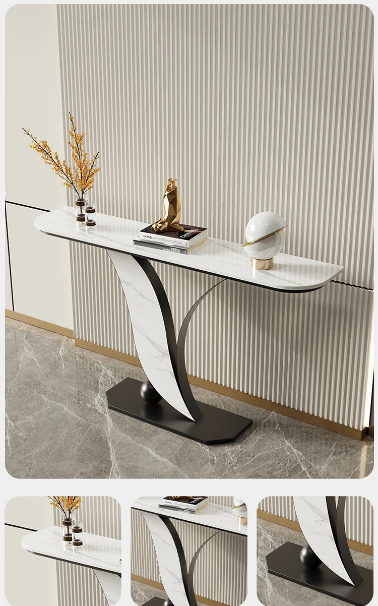 Modern console table with decorative items against a striped wall.