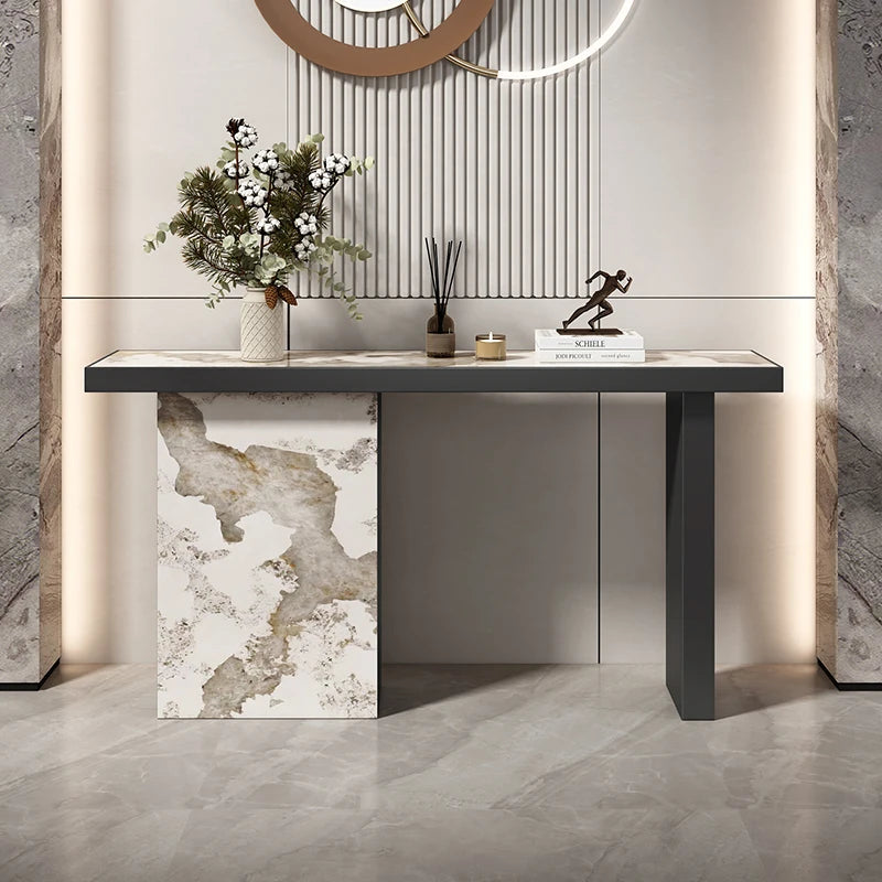 Modern console table with decorative items against a neutral wall.