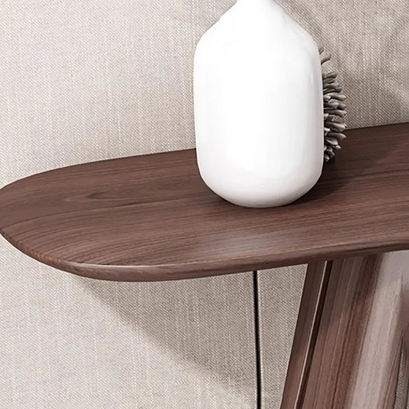 Wooden side table with a white lamp on a neutral background