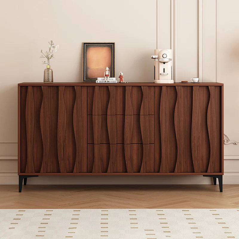 Wooden sideboard with decorative items against a neutral wall