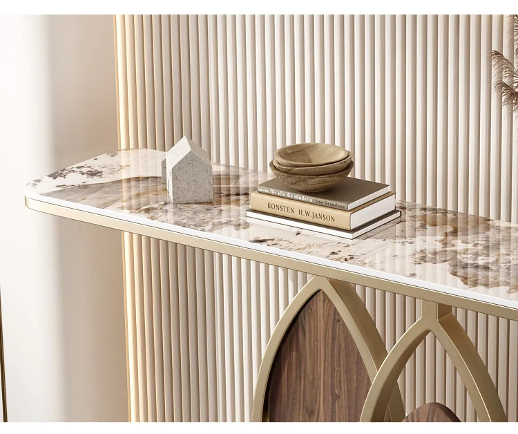 Decorative console table with marble top and wooden base against a neutral wall.