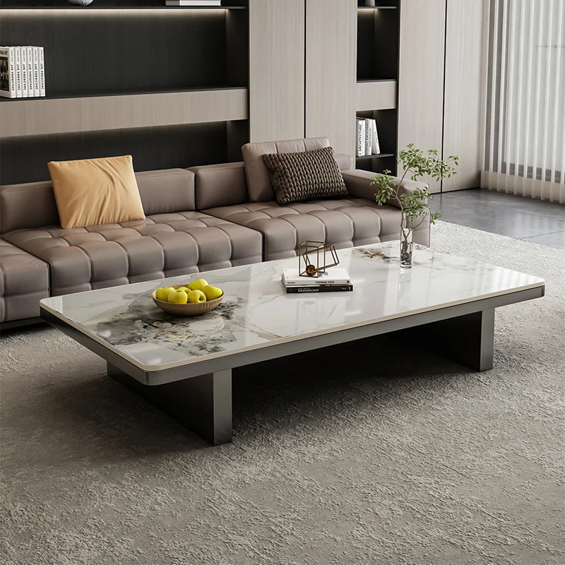 Modern living room with a gray sectional sofa and marble coffee table.