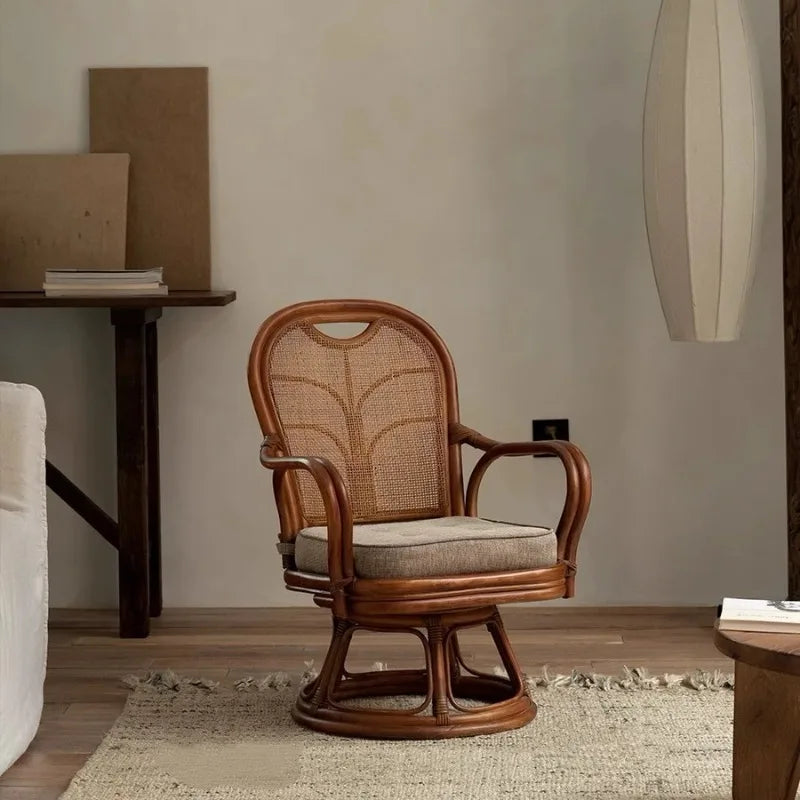 Wooden swivel chair with woven backrest in a room setting