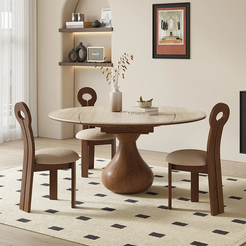 Dining room with wooden table and chairs on a patterned rug