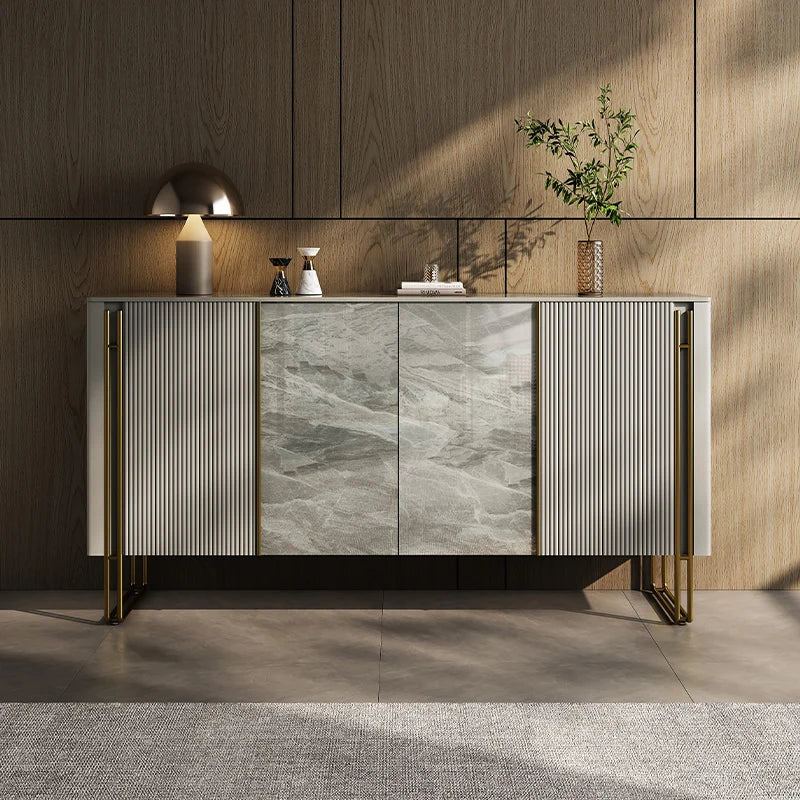 Modern sideboard with marble and metal design in a room with wooden walls.