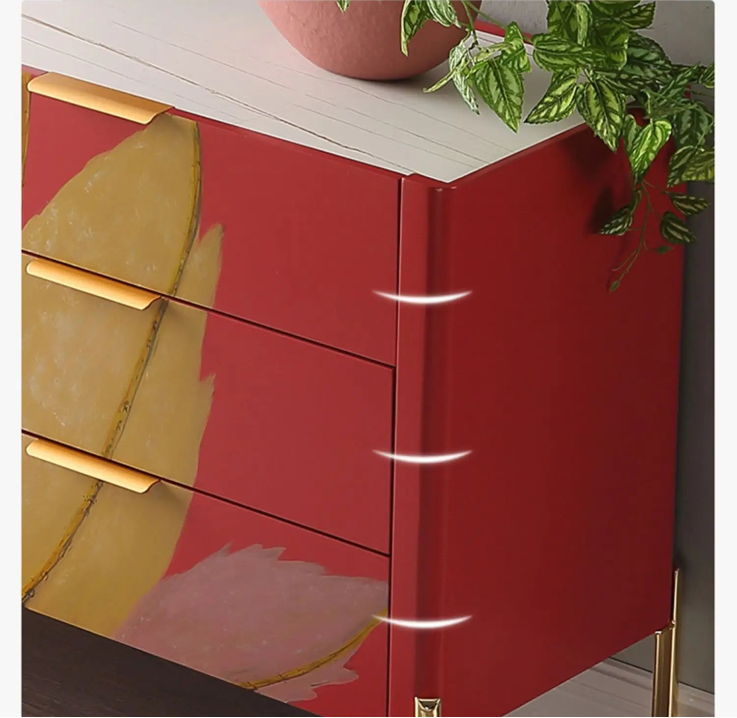 Red drawer with gold handles on a white surface, featuring text about safety and design.