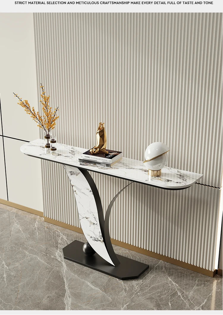 Modern console table with decorative items against a striped wall.