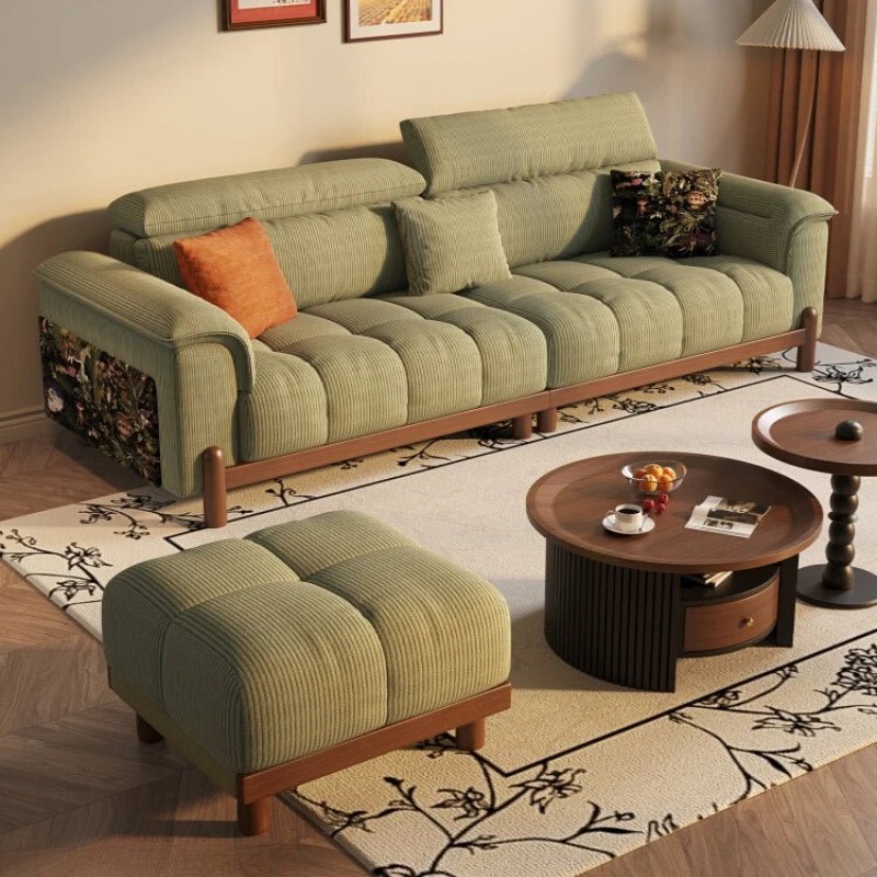 Green sofa with wooden legs in a living room setting