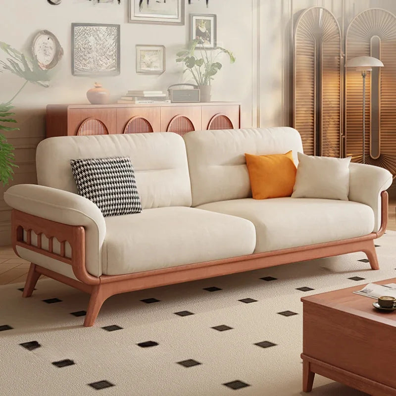 Beige sofa with wooden frame in a living room setting