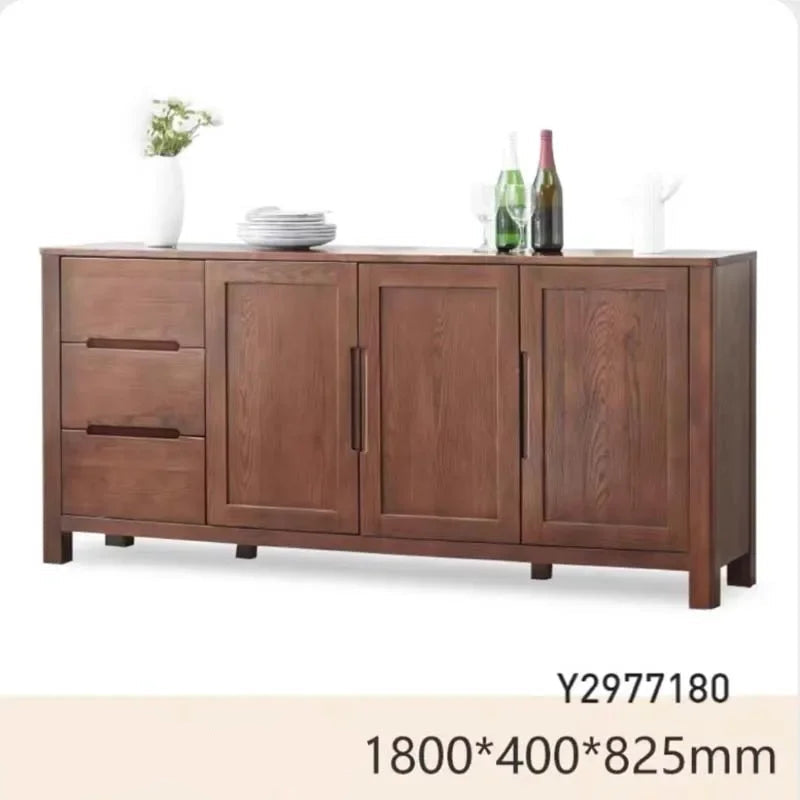 Wooden sideboard with decorative items on a white background