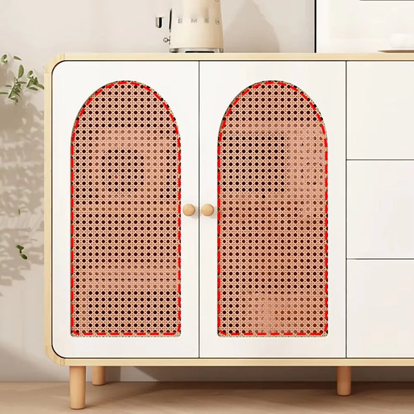 White cabinet with wicker doors in a room setting
