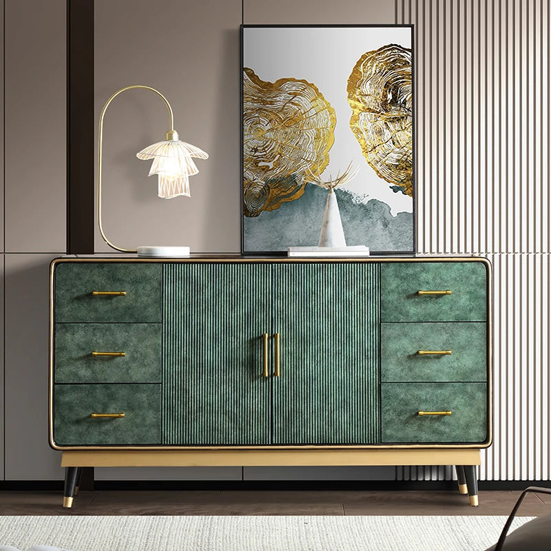 Modern green dresser with gold accents in a stylish room.