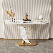 Modern console table with marble design and decorative items against a neutral wall.