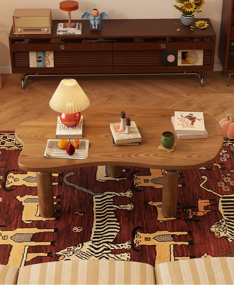 Wooden coffee table with decorative items in a living room setting