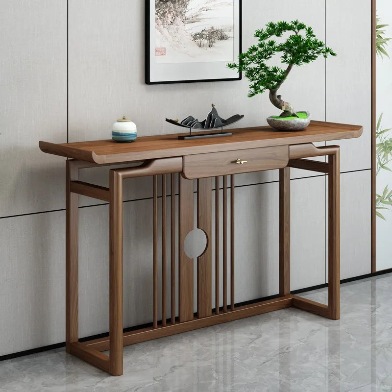 Wooden console table with decorative items in a modern interior setting