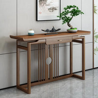 Wooden console table with decorative items in a modern interior setting