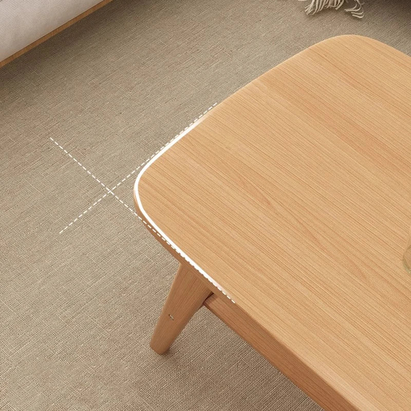 Wooden table corner on a textured floor