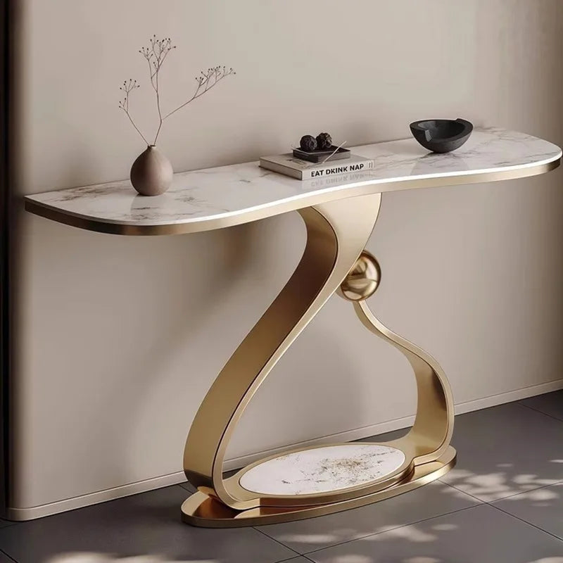 Marble console table with gold base against a neutral wall