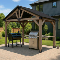 Wooden pergola with two grills on a patio