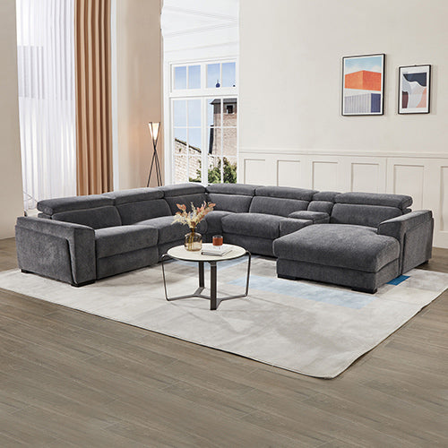 Gray sectional sofa in a living room with a coffee table and decor items.