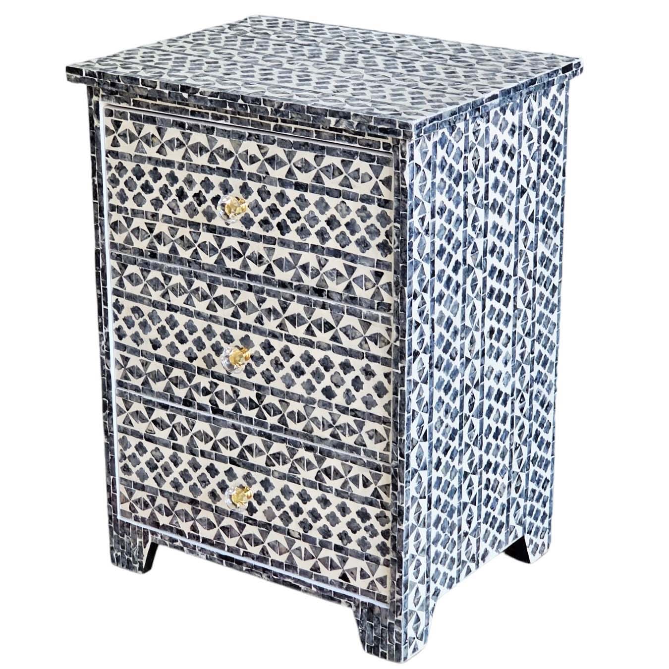 Decorative chest of drawers with mosaic pattern on a white background
