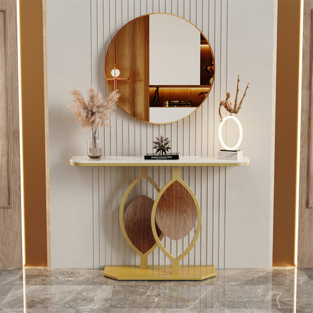 Decorative console table with mirror and decorative items against a wall.