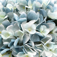 Artificial blue hydrangea in delicate mixed blue petals with glass vase
