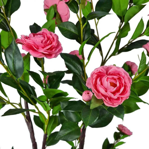 Artificial flowering camellia tree - pink 100cm with pink flowers in vase on table