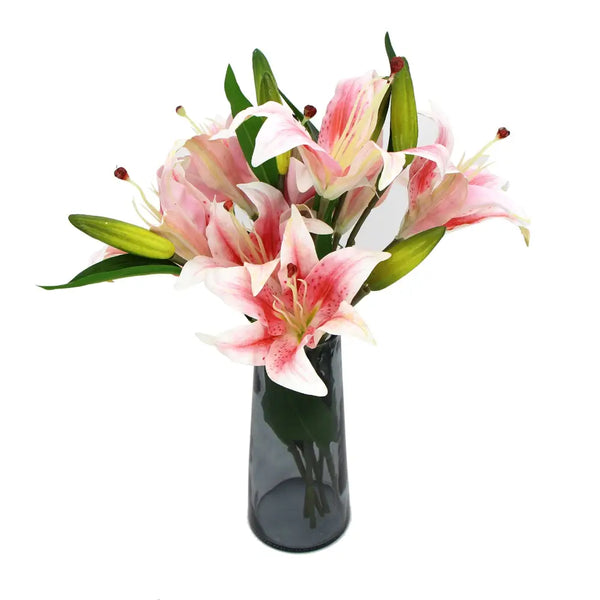 Artificial pink lily in glass vase with beautiful mixed pink and white flowers