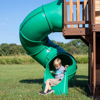 Boy playing on slide at cedar cove play centre with web swing and action-packed features