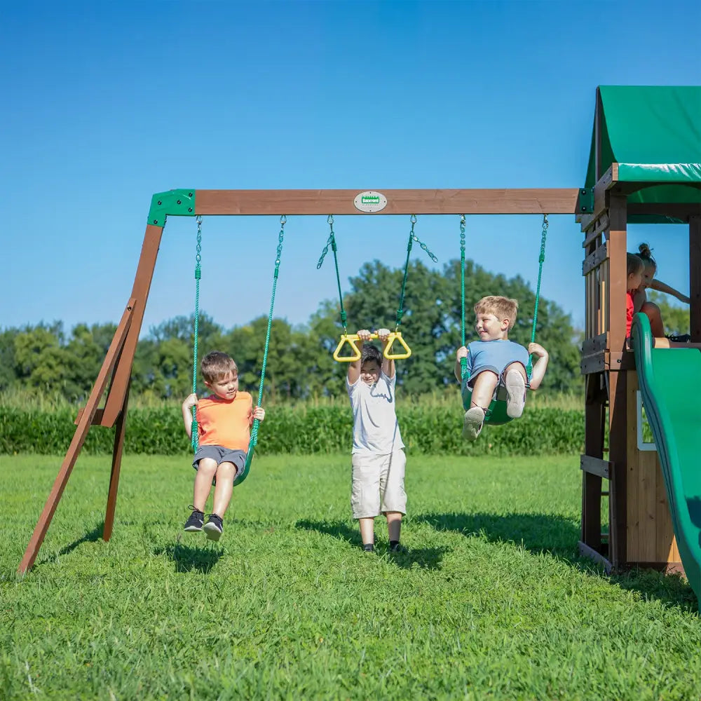 Backyard discovery lakewood play centre with two children on swing set