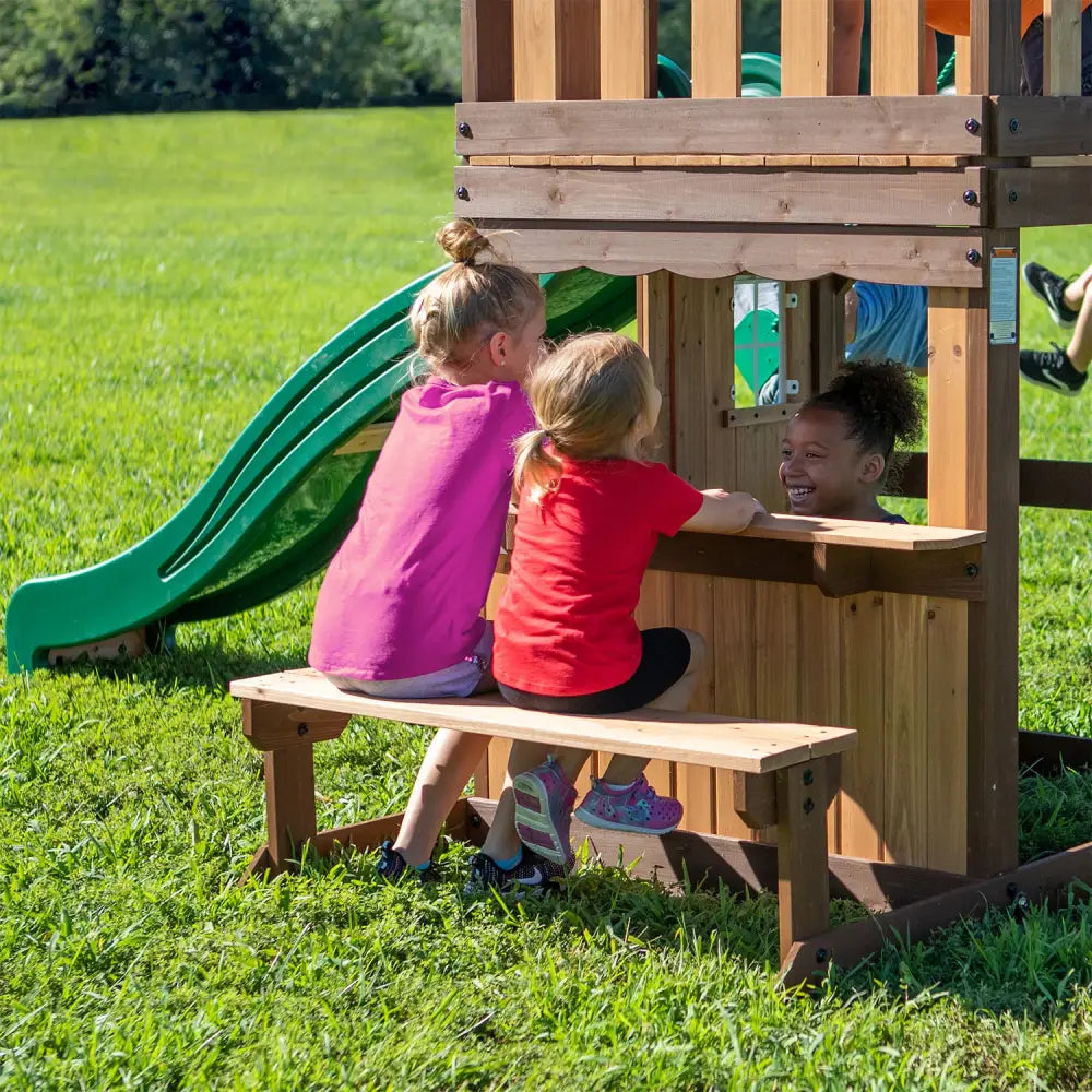 Wooden play structure with raised fort, two belt swings, and real door by backyard discovery lakewood play centre