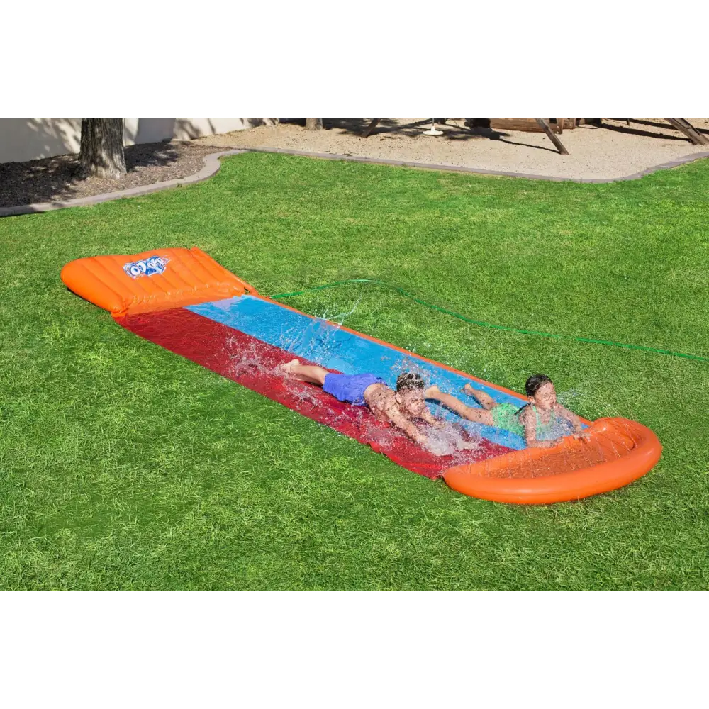 Young boy having fun in bestway kids h20go inflatable pool with water slide