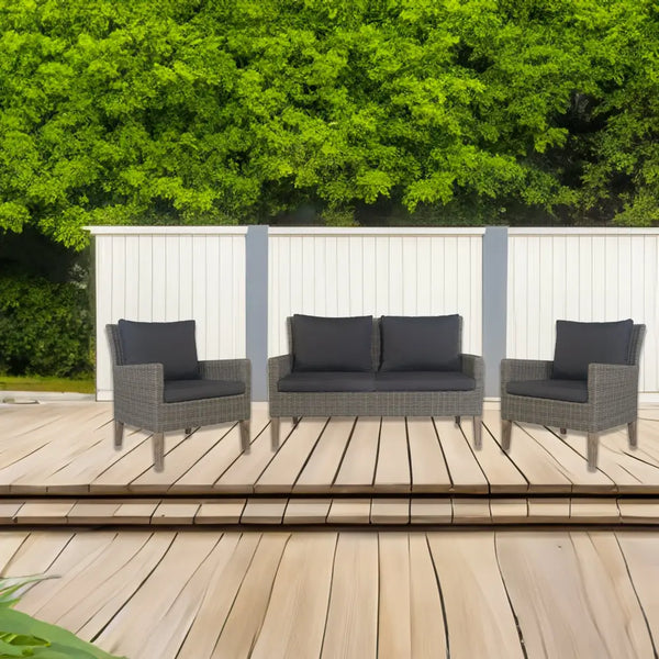 Hampton style outdoor lounge set with wooden deck and white fence