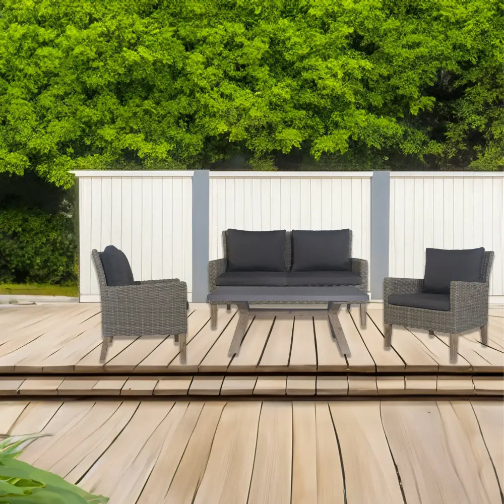 Outdoor patio with wooden deck, white fence, and sandblasted acacia coffee table loung set