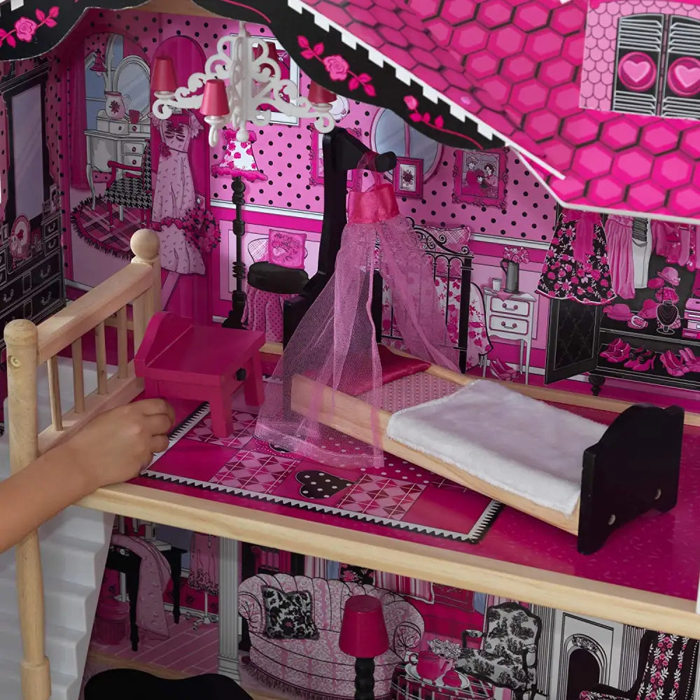 Barbie dollhouse with pink and black interior, includes 15-piece accessories