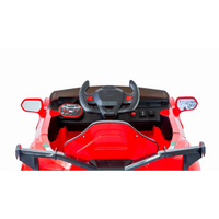 Red ferrari inspired 12v ride-on electric car - close-up steering wheel view