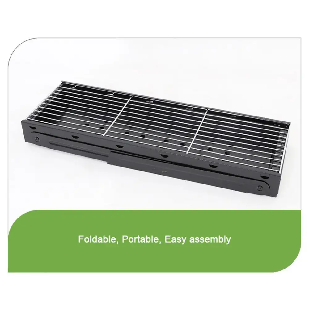 Foldable portable bbq charcoal grill with black metal grate on green background
