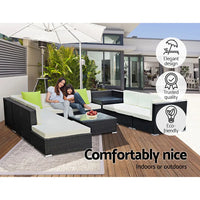 Woman sitting on gardeon outdoor sofa set with umbrella and tempered glass corner table, 75cm x 60cm