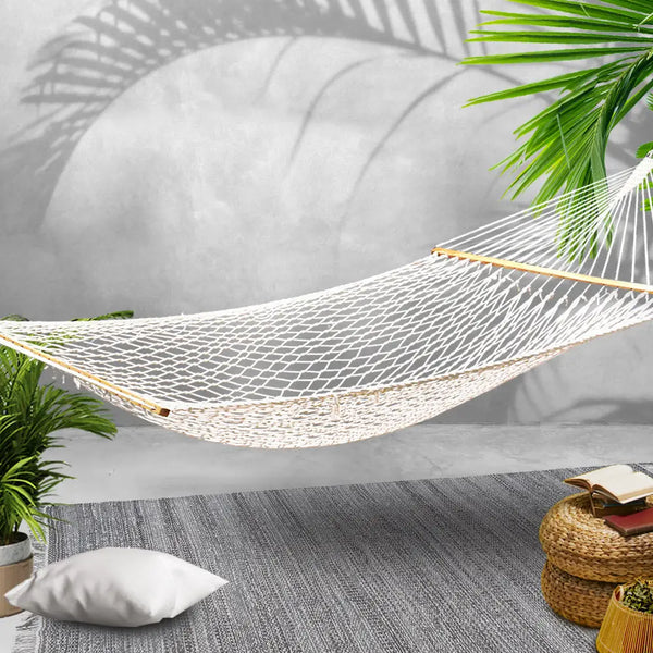 Gardeon 2 person cotton rope hammock - cream on solid wooden rug with plant background