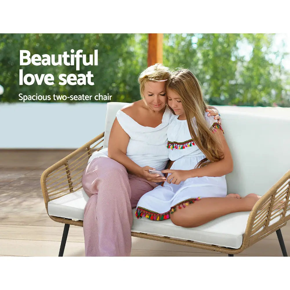 Gorgeous outdoor setting with woman sitting on chair using cell - gardeon 4-piece outdoor sofa set rattan - natural & white