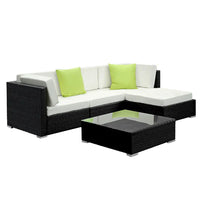Gardeon outdoor furniture set with couch, table, and pillows